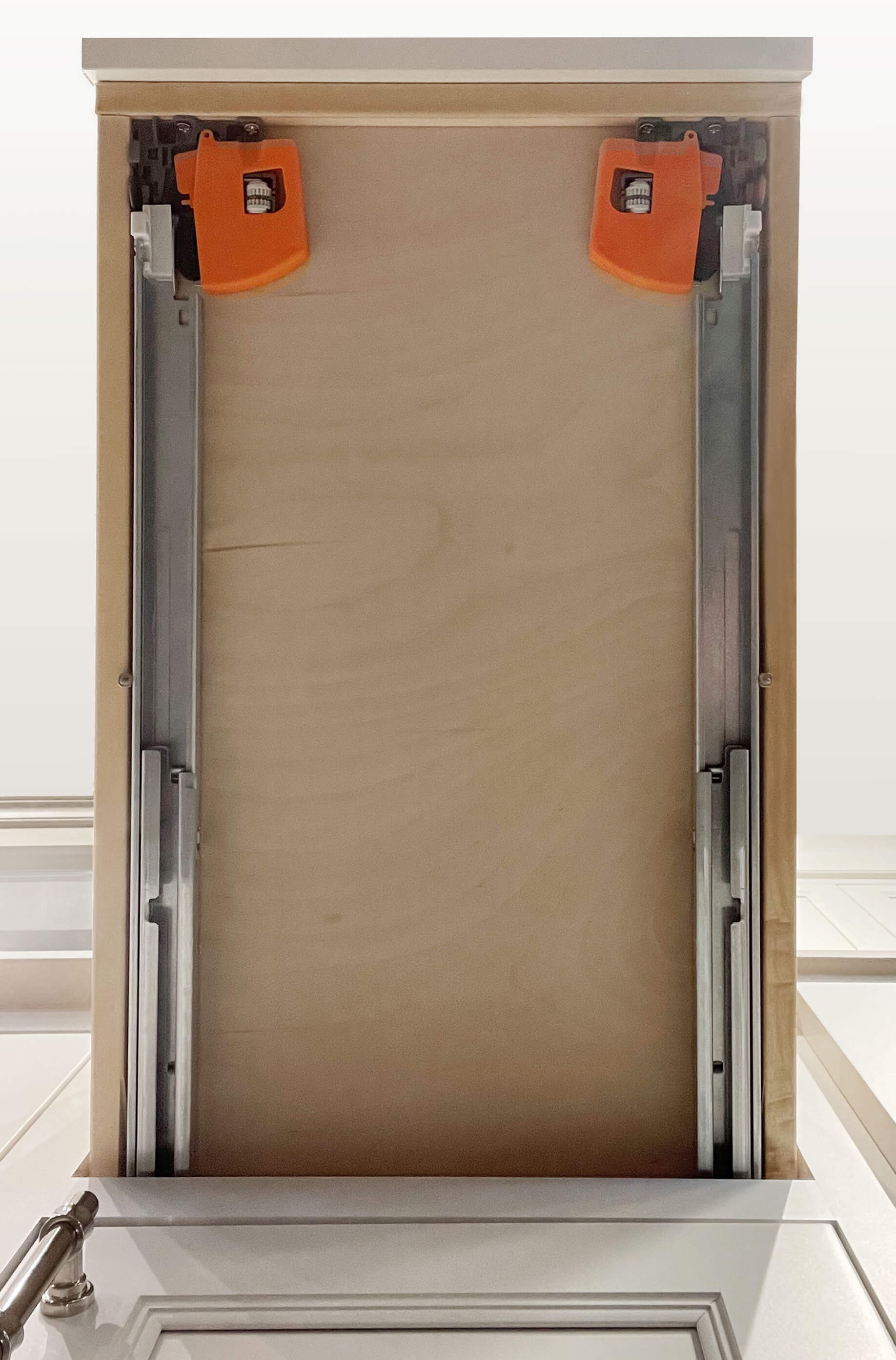 Full underside of a drawer showing both undermount rails and release fittings